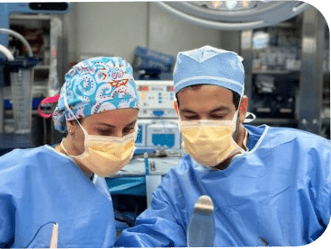 Jason and colleague performing surgery